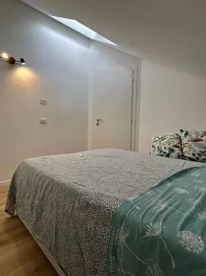 Letto o letti in una camera di Villetta bifamiliare Jesolo