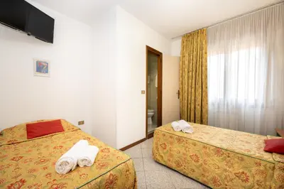 Letto o letti in una camera di Camelia Rooms Venice Guesthouse