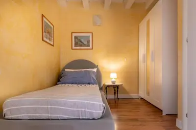 Letto o letti in una camera di Suite Palladio Centro Vicenza A 2 Passi da Piazza dei Signori Check-in Veloce