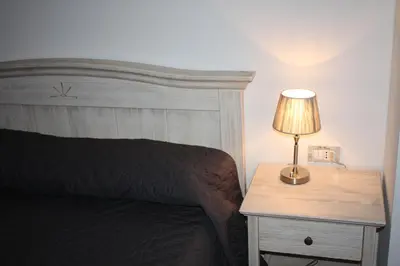 Letto o letti in una camera di Elis' Rooms