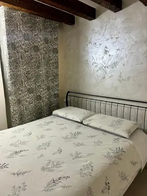 Letto o letti in una camera di Ca'Rosa