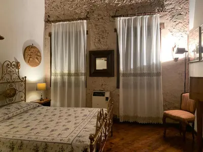 Letto o letti in una camera di IL CASALE DEL VINO