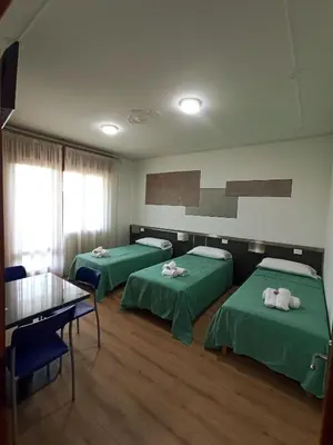 Letto o letti in una camera di Affittacamere Ai Pila
