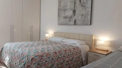 Letto o letti in una camera di Casa quinto piano - moderno appartamento con garage privato