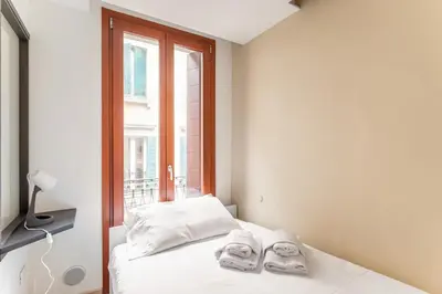 Letto o letti in una camera di GuestHost - Padova - Piazza dei Signori Central Flats