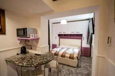 Letto o letti in una camera di San Polo Studio
