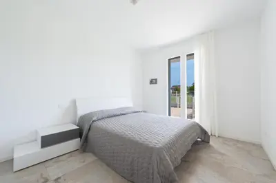 Letto o letti in una camera di KAUAI Apartments