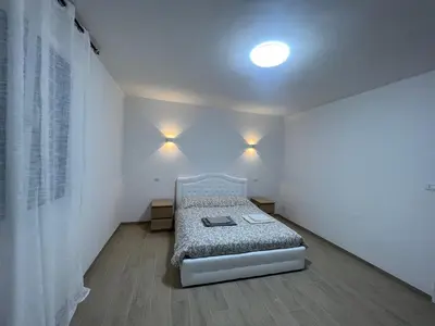 Letto o letti in una camera di Casa Roma rooms&apartments