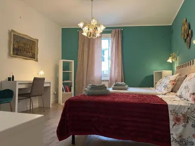 Letto o letti in una camera di Ca' Rioba - Patio Privato e Vista Canale a Cannaregio