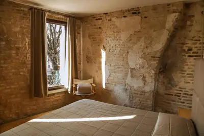 Letto o letti in una camera di Locanda Ponte Dante