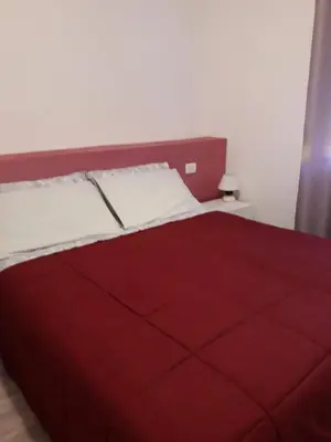 Letto o letti in una camera di B&B A Un Passo Da
