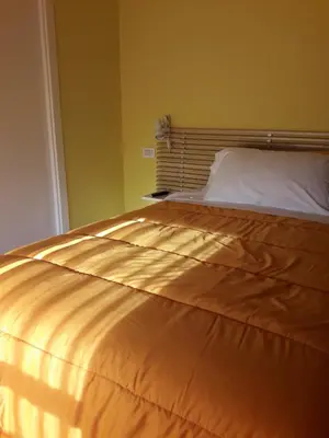 Letto o letti in una camera di B&B A Un Passo Da