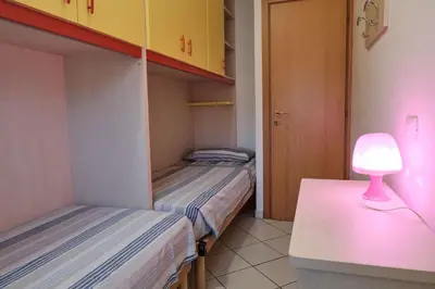 Letto o letti in una camera di Poolside escape in Rosolina-Beahost