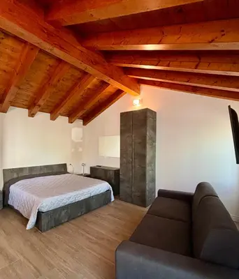 Letto o letti in una camera di Case Stevanato appartamento Mia