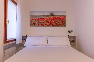 Letto o letti in una camera di Giustiniani Apartments