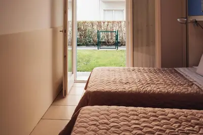 Letto o letti in una camera di ANIMA JESOLO - DRAGO VILLAGE, Beach & Pool, 2 Parkings