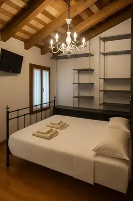 Letto o letti in una camera di Benvenuti in Casa Peluca!