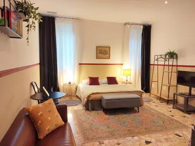 Letto o letti in una camera di Loft Loggia al Santo - zona ospedale e centro storico