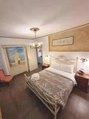 Letto o letti in una camera di Ca'Briani Luxury - Behind S.Mark Square