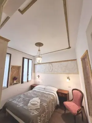 Letto o letti in una camera di Ca'Briani Luxury - Behind S.Mark Square