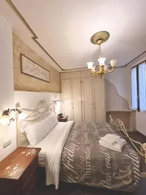 Letto o letti in una camera di Ca'Briani Luxury - Behind S.Mark Square