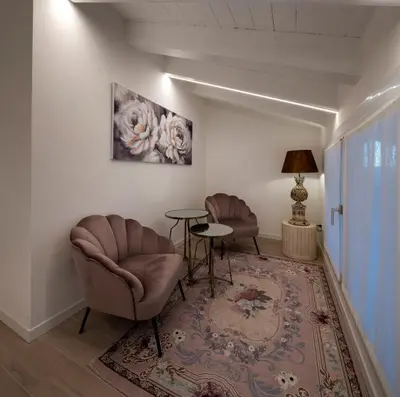 Area soggiorno di Camerini Guest House
