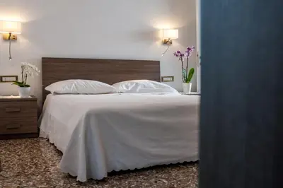 Letto o letti in una camera di Ca' Dorè