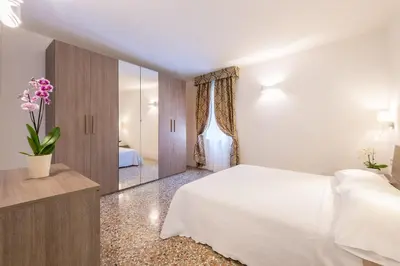 Letto o letti in una camera di Ca' Dorè