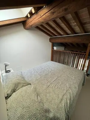 Letto o letti in una camera di Elegante alloggio in casa storica-Borgo Portello