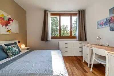 Letto o letti in una camera di enJoy Home - appartamento I Papaveri