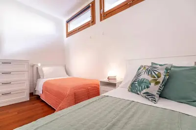 Letto o letti in una camera di enJoy Home - appartamento I Papaveri