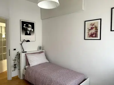Letto o letti in una camera di spazio ellero
