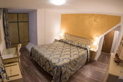 Letto o letti in una camera di Albergo Casa Peron