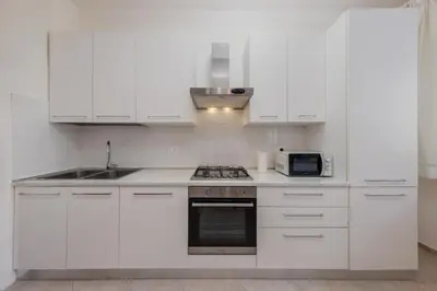 Cucina o angolo cottura di Gate2-MarcoPoloAirport-2 camere da letto-Wifi-Netflix-15' da Venezia