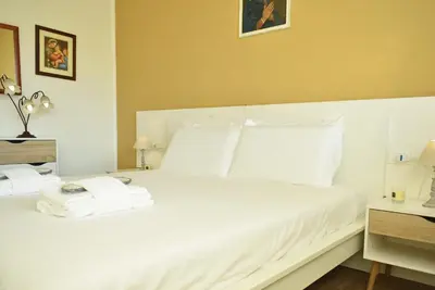 Letto o letti in una camera di Welc-ōM Shabby Montegrotto