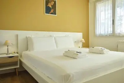 Letto o letti in una camera di Welc-ōM Shabby Montegrotto