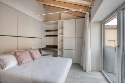 Letto o letti in una camera di Do POMI Suite