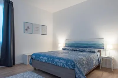 Letto o letti in una camera di Casa Carlotta al Portello, vicino al centro e all'ospedale