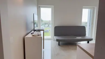 Area soggiorno di Fairmont Seafront Flamingo Suite by Ca-Sa Check