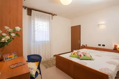 Letto o letti in una camera di Casa Battisti