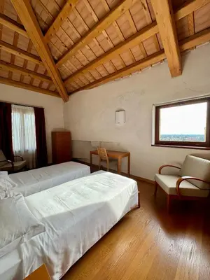 Letto o letti in una camera di Campus San Francesco