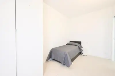 Letto o letti in una camera di L14 Apartments