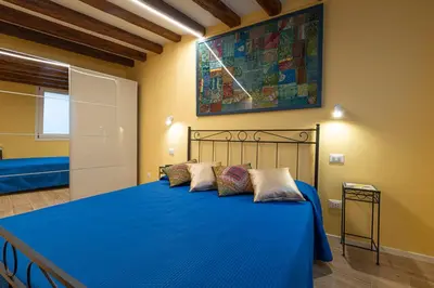 Letto o letti in una camera di DELUXE DOUBLE ROOM in VENICE CENTRE