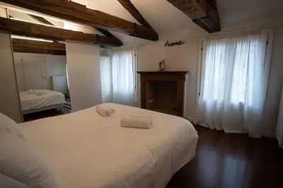 Letto o letti in una camera di Ca' Regina
