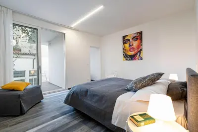 Letto o letti in una camera di Palazzo Ruzante Padova - Barcellona Apt