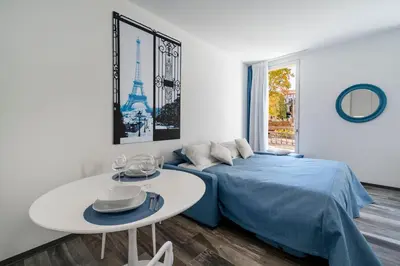 Letto o letti in una camera di Palazzo Ruzante Padova - Parigi Apt