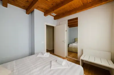 Letto o letti in una camera di Dimora Acquamarina