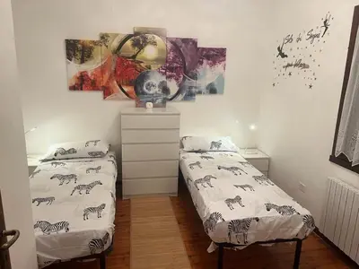 Letto o letti in una camera di APPARTAMENTO PANORAMICO