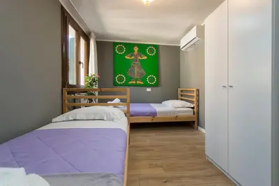 Letto o letti in una camera di Biennale Comfort House - modernità a Castello