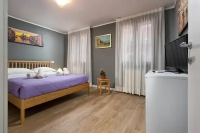 Letto o letti in una camera di Biennale Comfort House - modernità a Castello